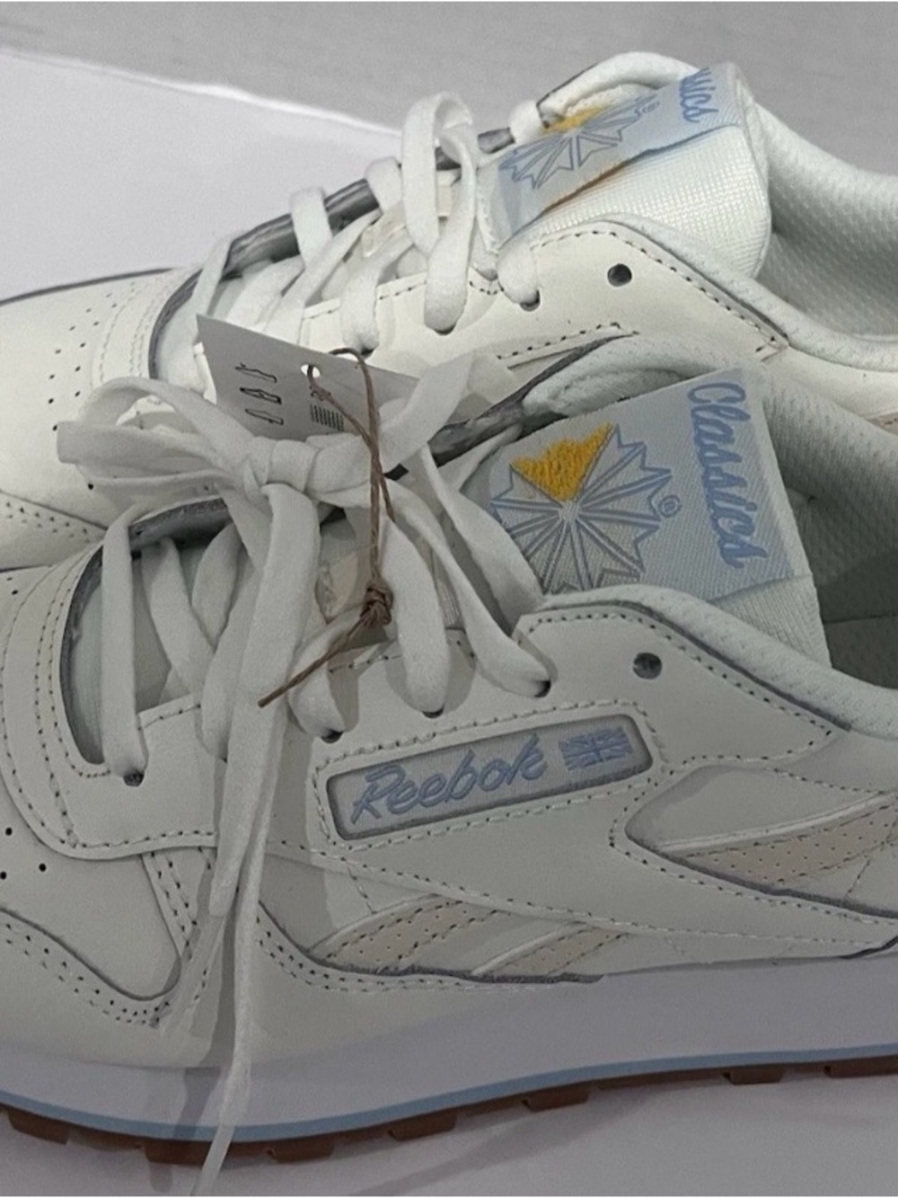Reebok Women's White Leather Classic Sneakers with Light Blue & Yellow Accents